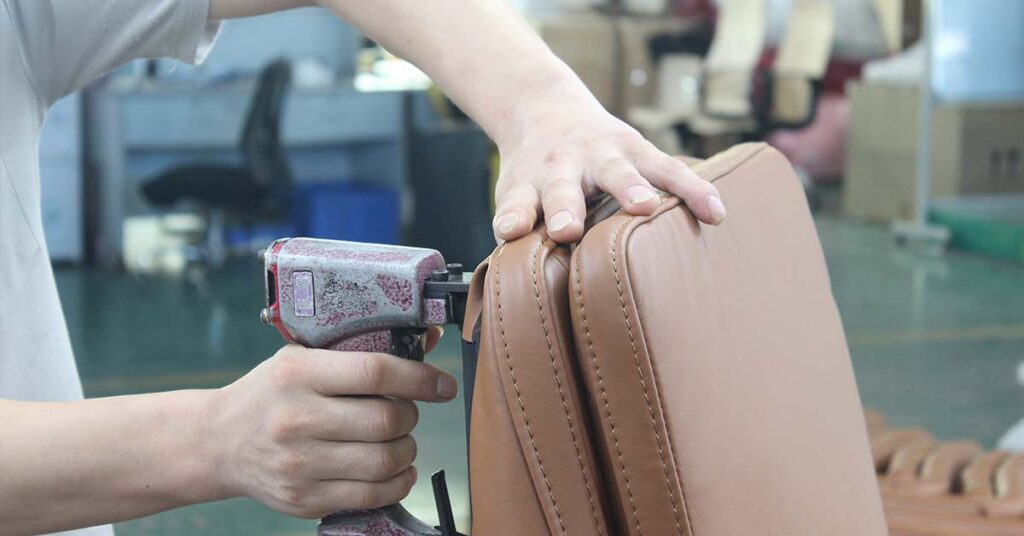 Foam upholstery and hand stapling process for zero-gravity sofas