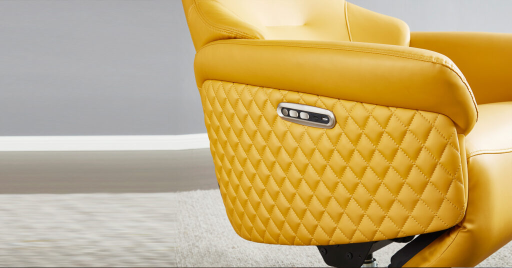 Close-up of hidden touch sensor controls and USB ports on the armrest of a home office power recliner